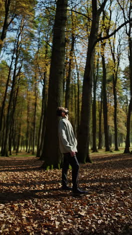 man walking in a beautiful autumn forest