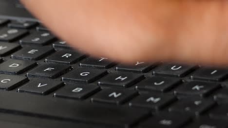 Pressing buttons on Laptop mechanical keyboard, up close computer worker
