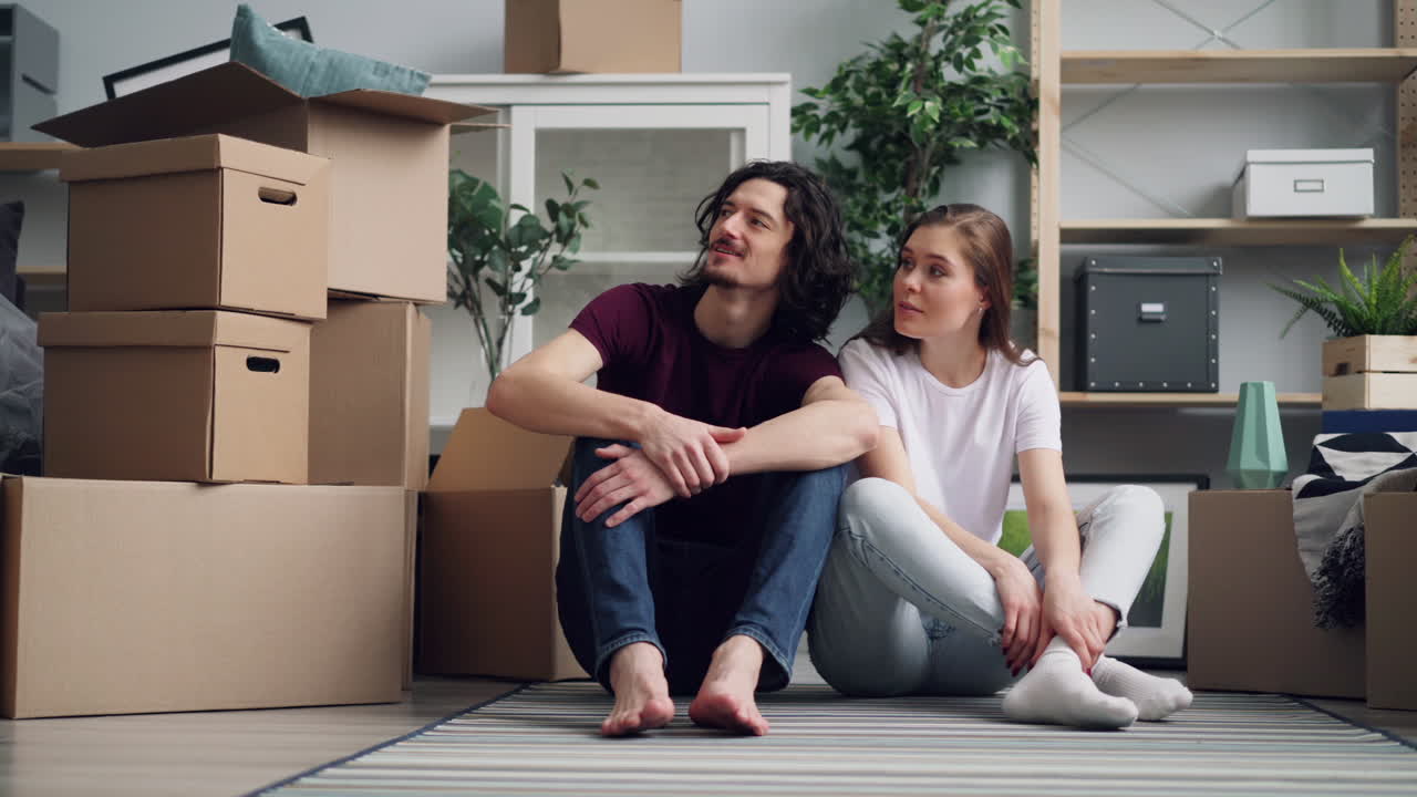 Couple Sitting Together in a Newly-Moved Apartment
