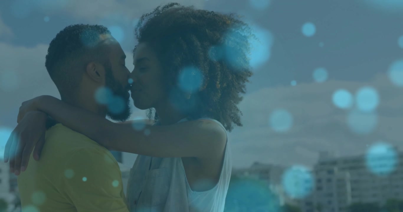 Young Couple Embracing and Kissing Outdoors with Digital Overlay