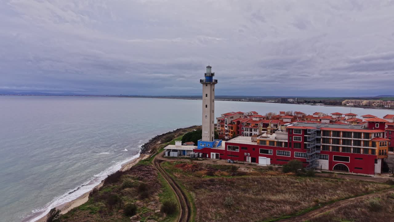 Coastal view of a lighthouse and colorful buildings in Bulgaria