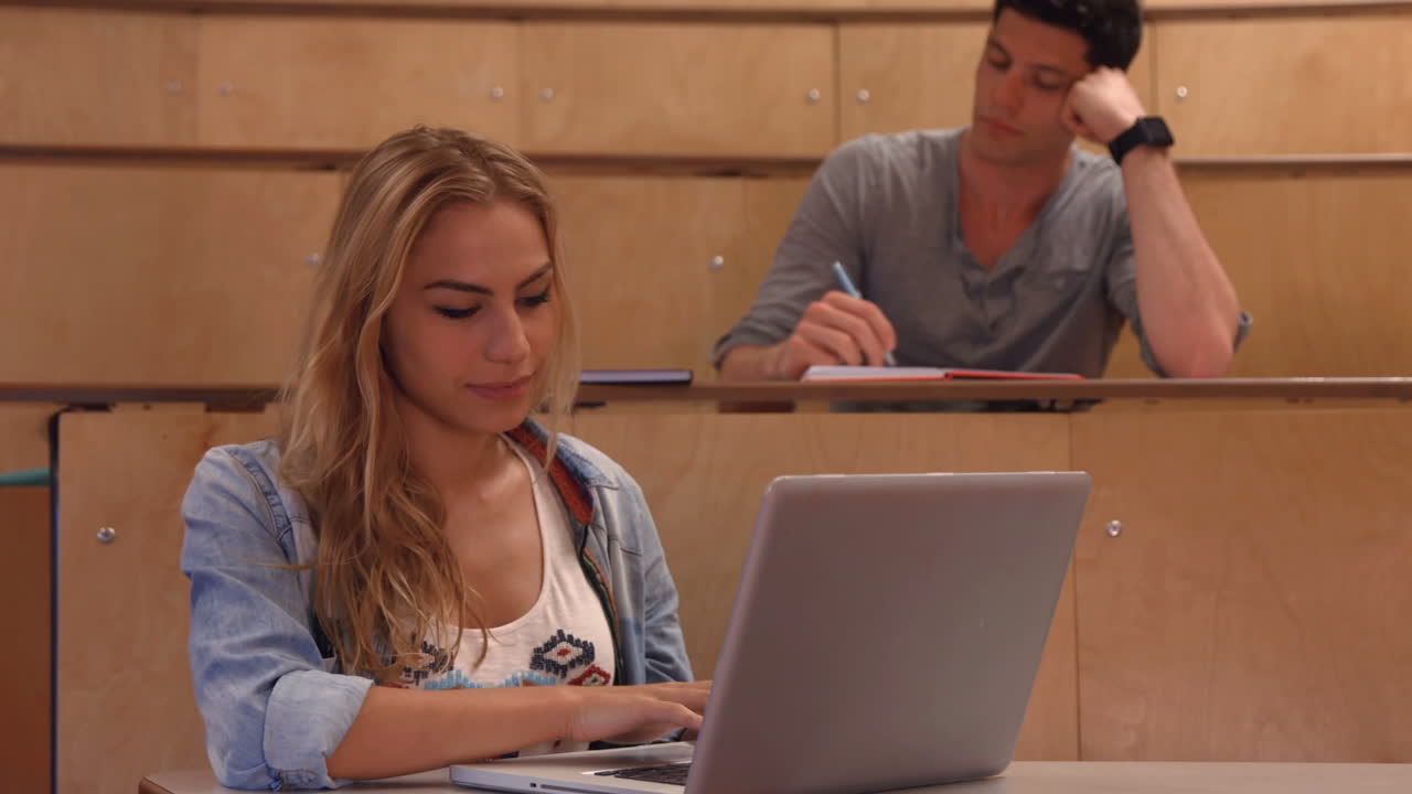Students taking notes in lecture