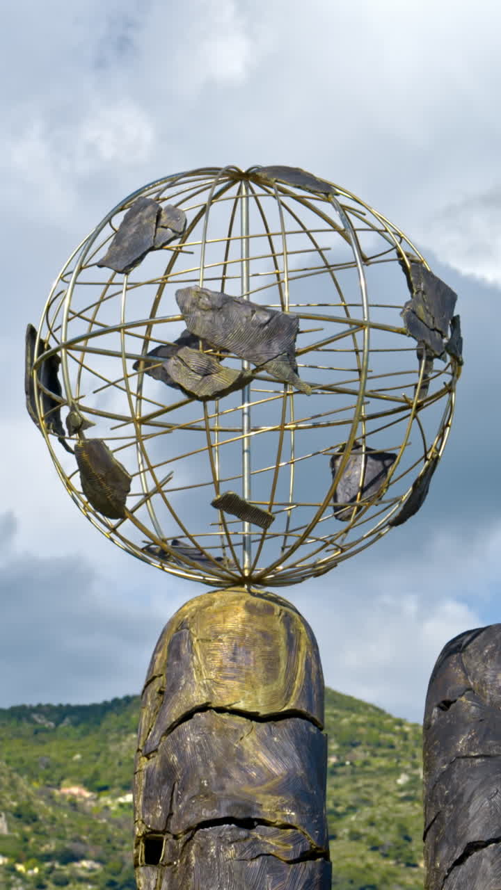 Kindly Lent sculpture by Johann Young on Boulevard Louis II in Monaco. Vertical