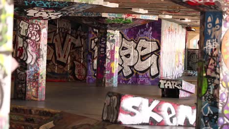 skateboarder performing tricks in urban skatepark