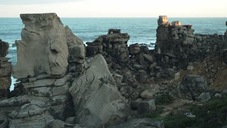 group of ocean cliffs or rocks on cascais portugal coast, panning right view