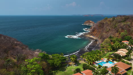 Aerial-view-over-luxury-villas-on-the-coastline-of-Guanacaste,-in-sunny-Costa-Rica