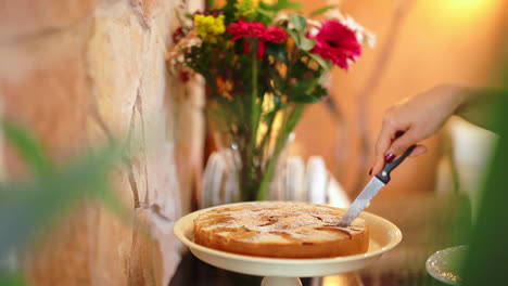 Gratifying-compound-marble-cake-slicing-in-luxury-hotel-kitchen