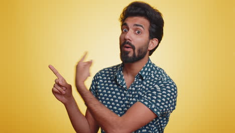 Bearded-indian-man-looking-at-camera-doing-phone-gesture-like-says-hey-you-call-me-back-conversation