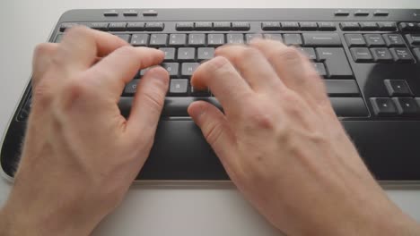 man typing on a keyboard