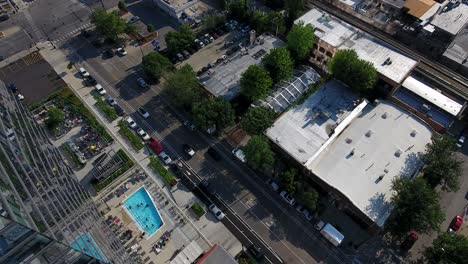 Birds-Eye-Aerial-View-of-Chicago-USA,-Wabash-Avenue-Traffic,-Residences-and-Buildings-on-Summer-Day