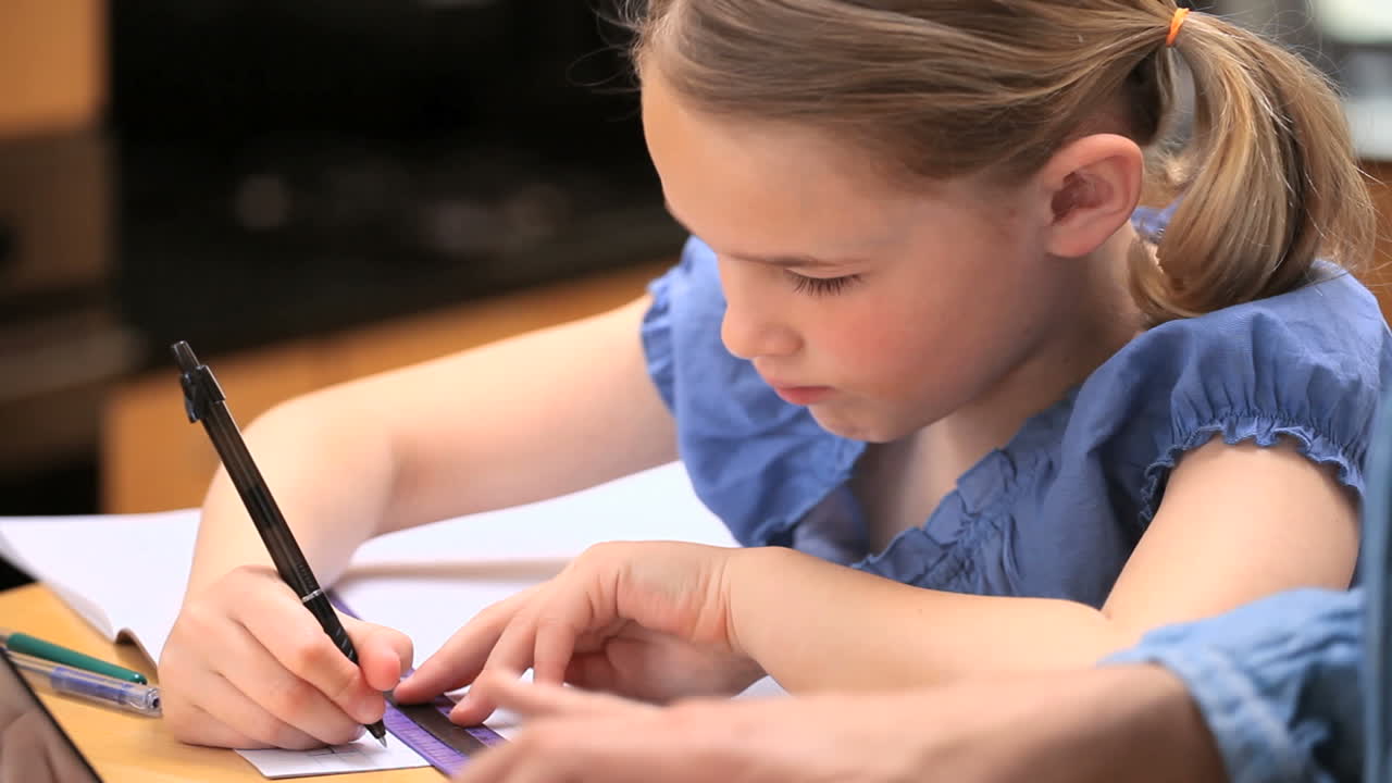 Serious girl doing her homework