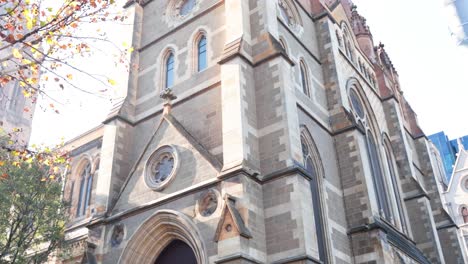 gothic architecture with people and trees visible