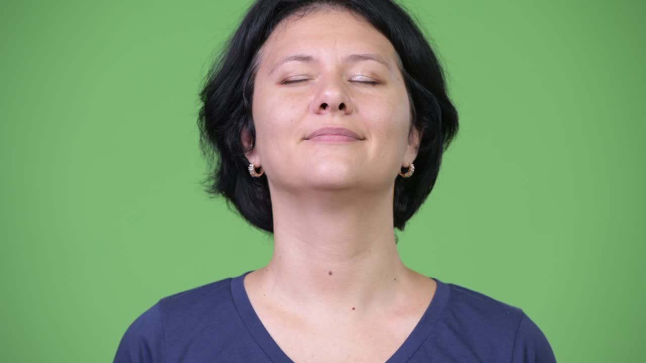 Beautiful woman with short hair relaxing with eyes closed