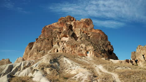 stone houses carved in goreme landscape, turkey