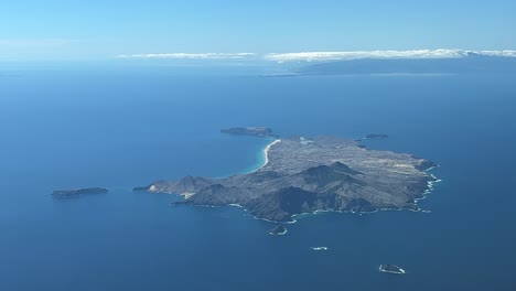 Aerial-view-of-Posto-Santo,-Portugal-shot-from-a-jet-cabin-flying-at-3000m-high