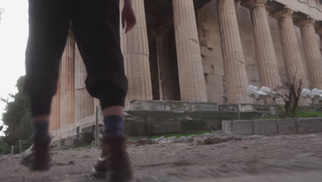 Walking-up-stairs-to-ruins-in-Athens,-Greece