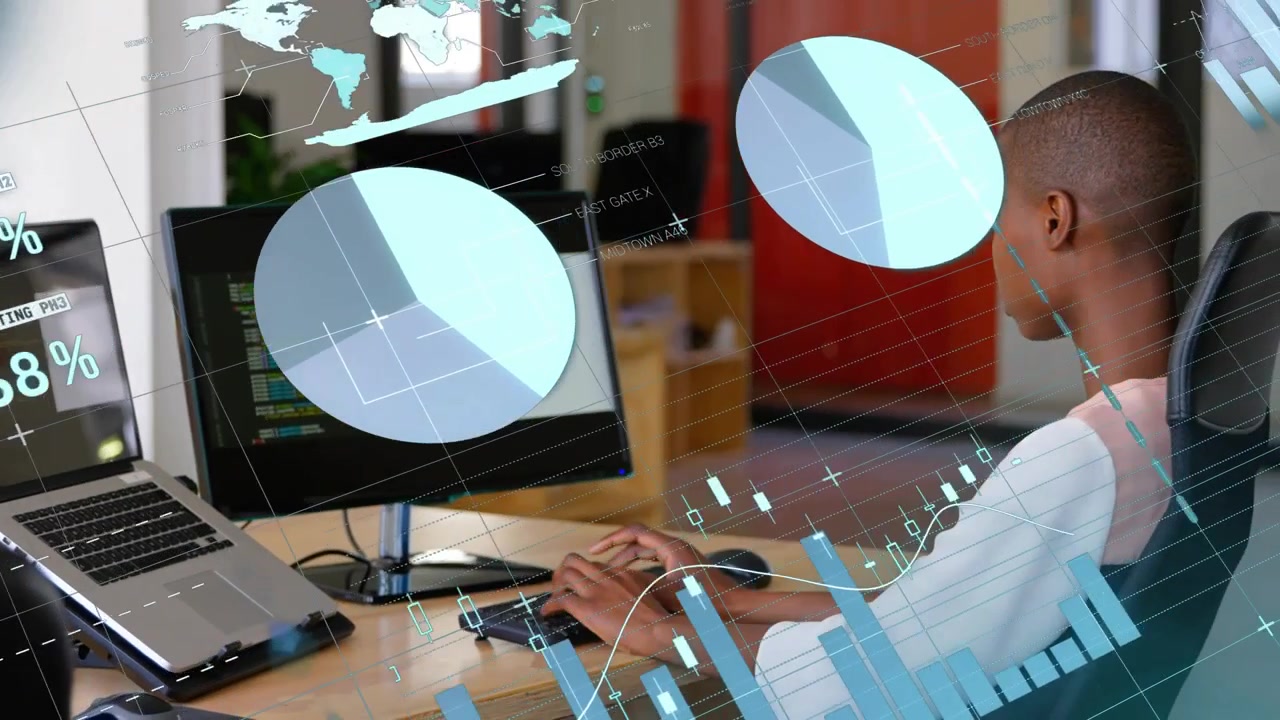 Software engineer typing code after colleague pointing at screen, animating charts and world map