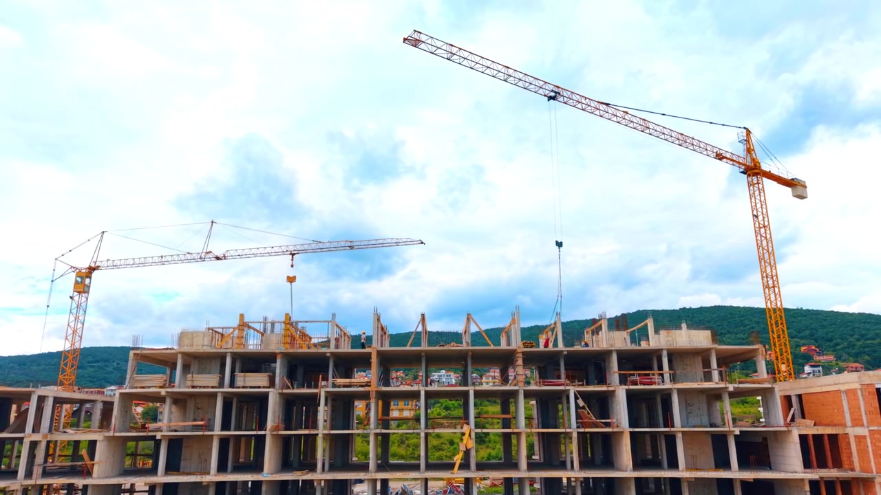 High-rise apartment building structure with concrete formwork system. Unfinished concrete upper floors of a residential high-rise building with safety structures.