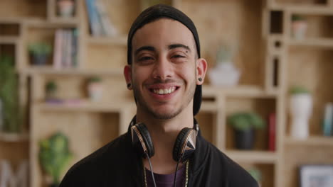 portrait happy teenage man student smiling enjoying relaxed lifestyle satisfaction confident hispanic male wearing stylish fashion hat