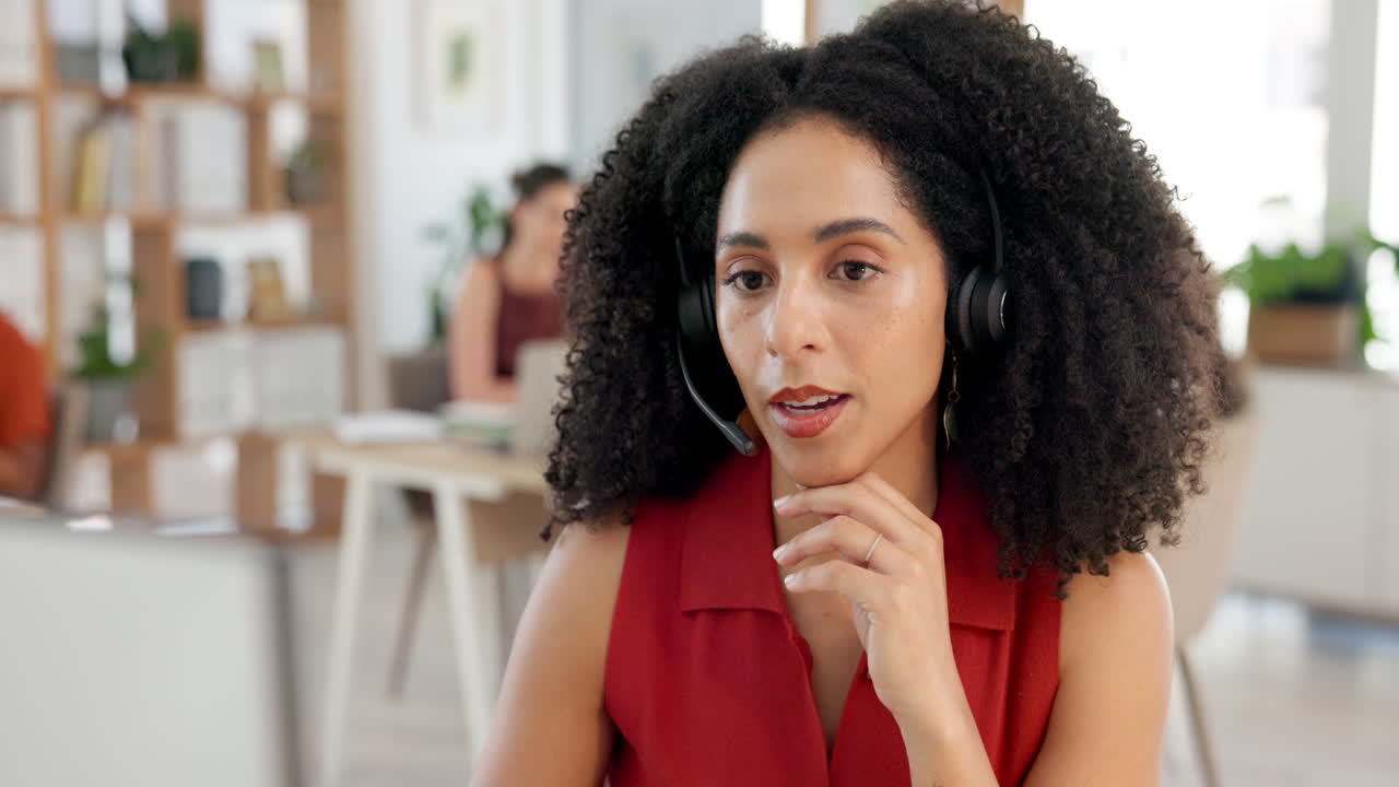 Focused Woman Wearing Headset Working in a Modern Office
