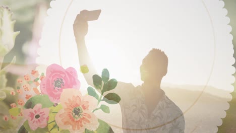 animation of african american man with smartphone on beach over flowers