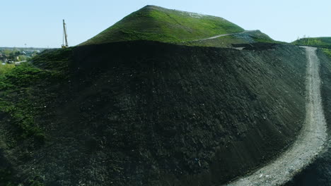 Drone-flight-over-the-garbage-dump-overgrown-with-vegetation