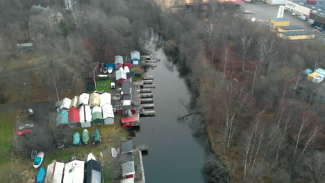 tiny river and sheds in middle of tiny forest