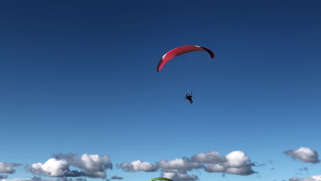 paramotoring in a blue sky
