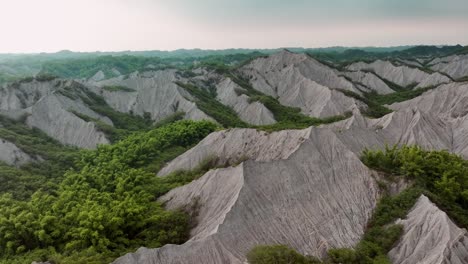 slow drone flight over tianliao moon world an area of badlands in tianliao district, kaohsiung, taiwan, 田寮月世界, tiánliáo yuè shìji?