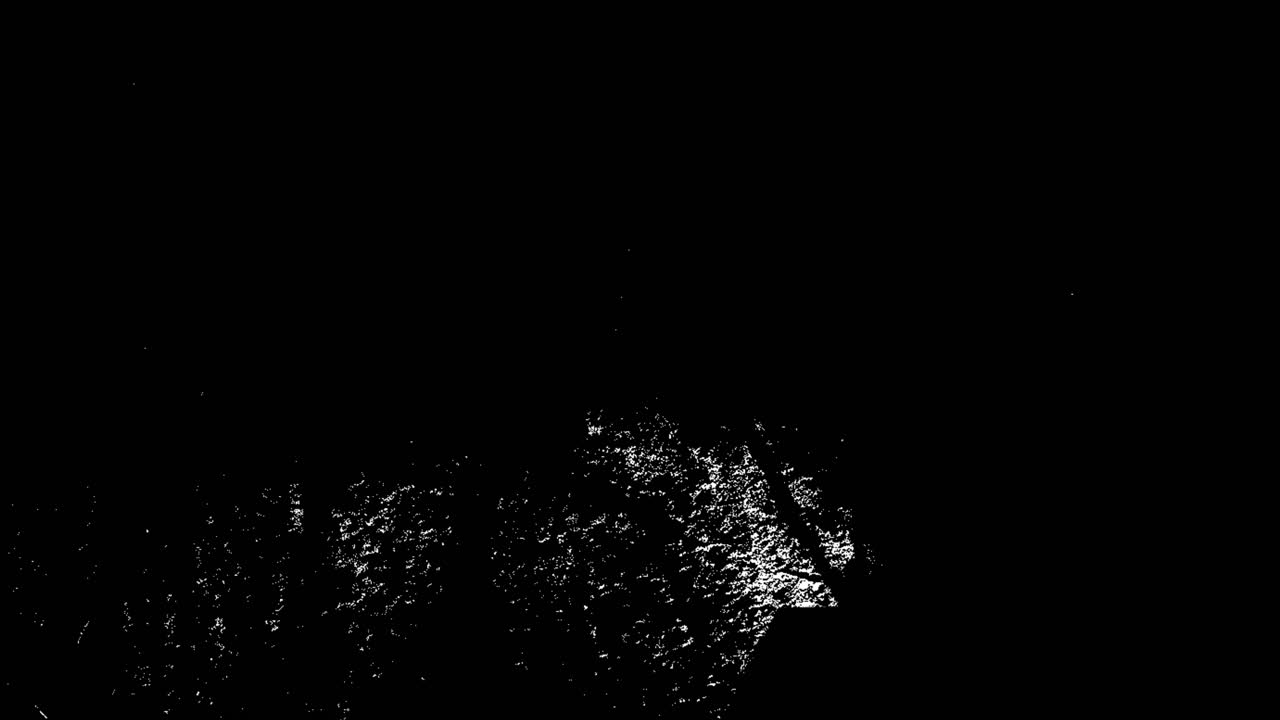 Abstracte witte grunge textuur overlay flikkerend op zwarte achtergrond