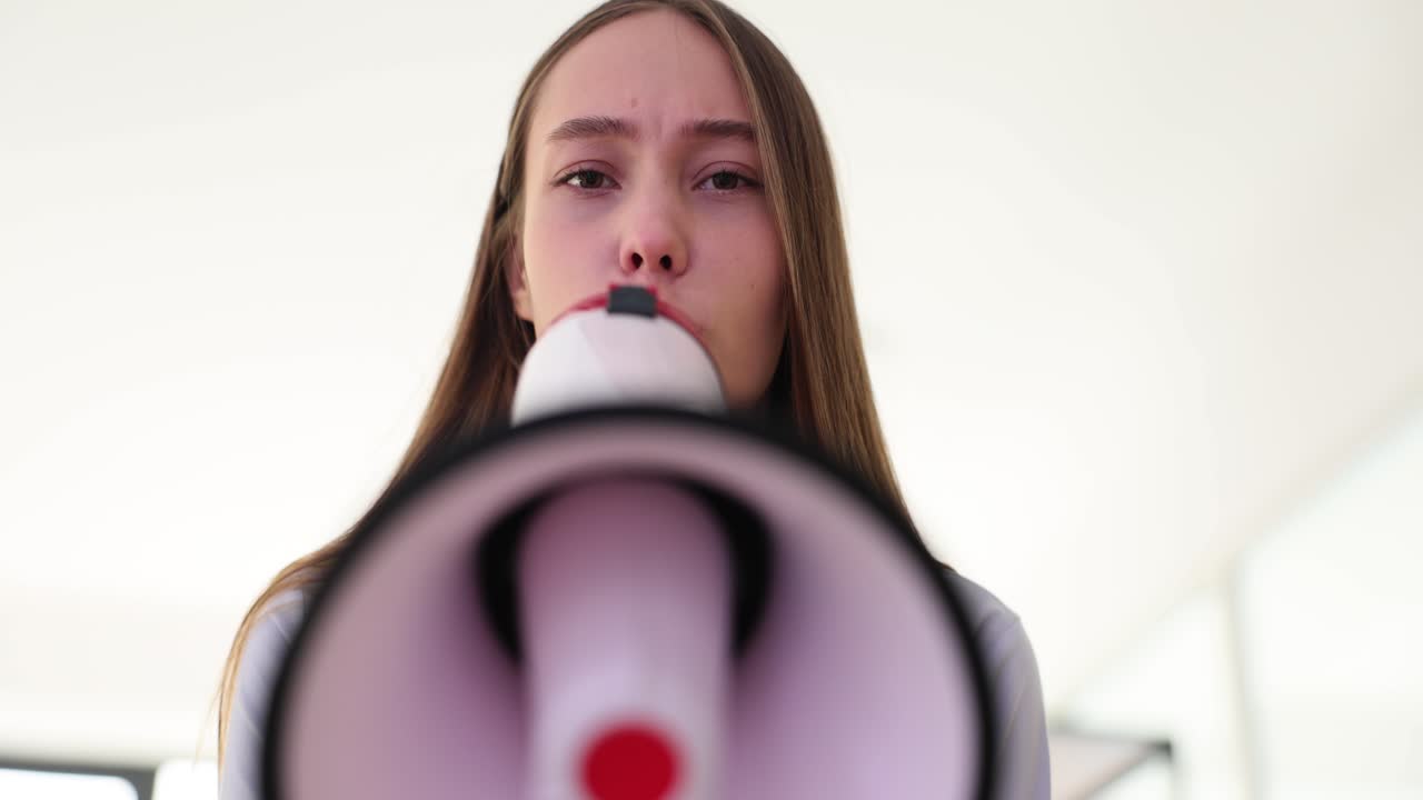 Young Woman Holding a Megaphone
