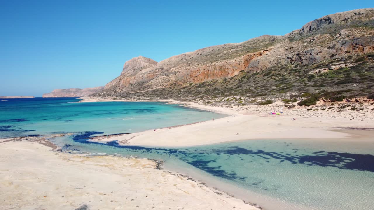 Crystal clear water of Balos beach, Crete, Greece. Shore with green water on Balos lagoon in sunny summer