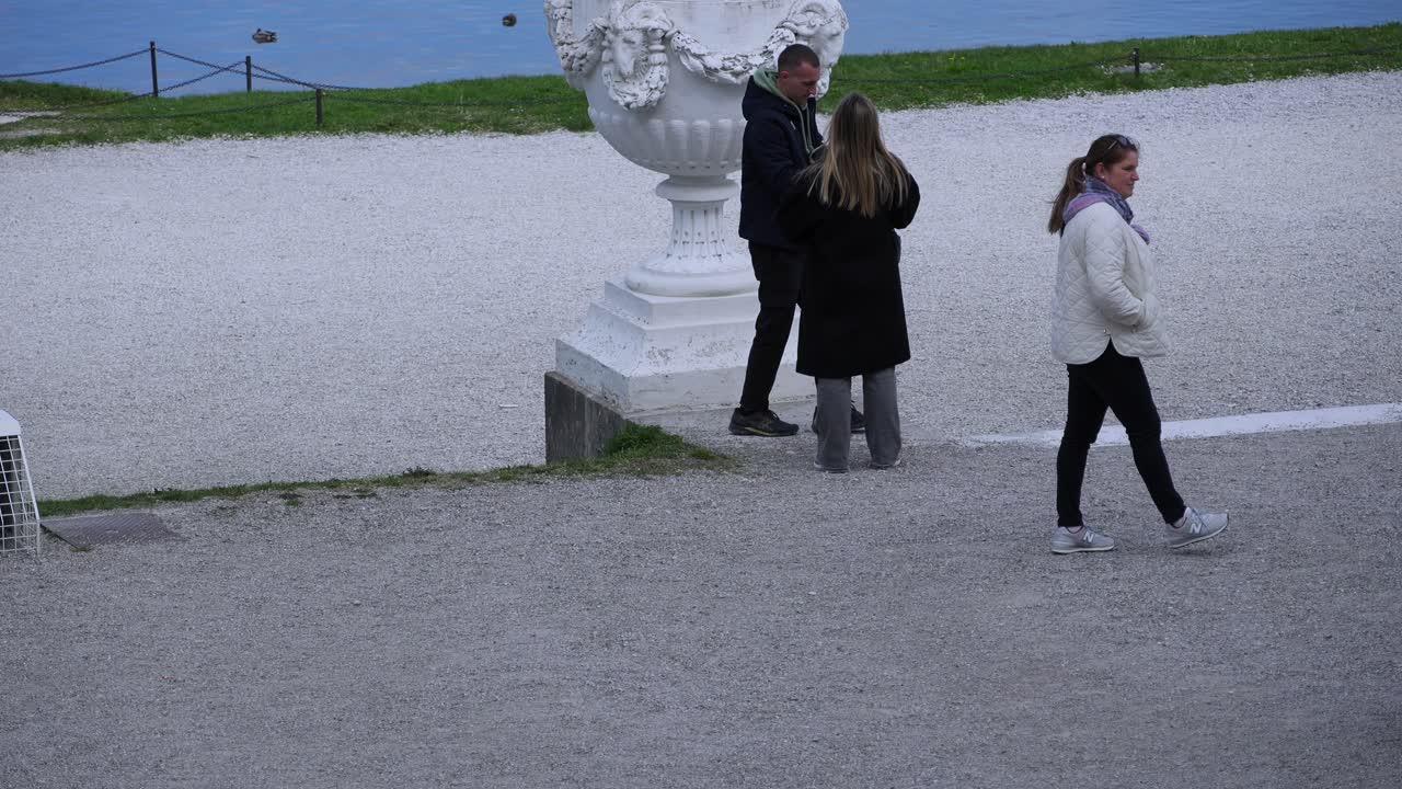 People strolling in Schonbrunn Palace Park in Vienna, Austria