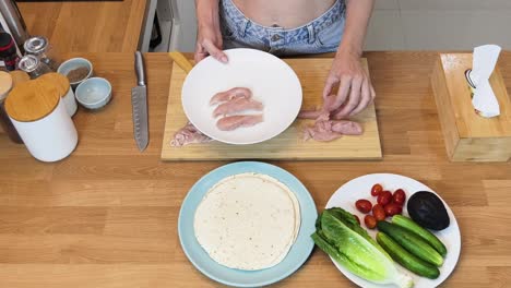 preparing chicken wraps