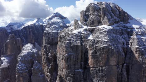 impressive aerial arc of snow covered sella mountains, dolomites, italy