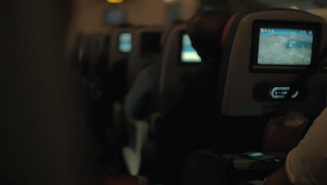 airplane cabin with passengers during night flight