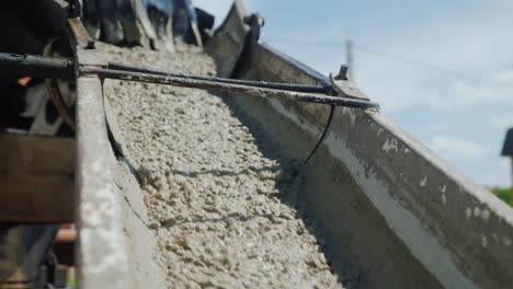 liquid cement flows gutter close-up cement on the construction site concept 4k video