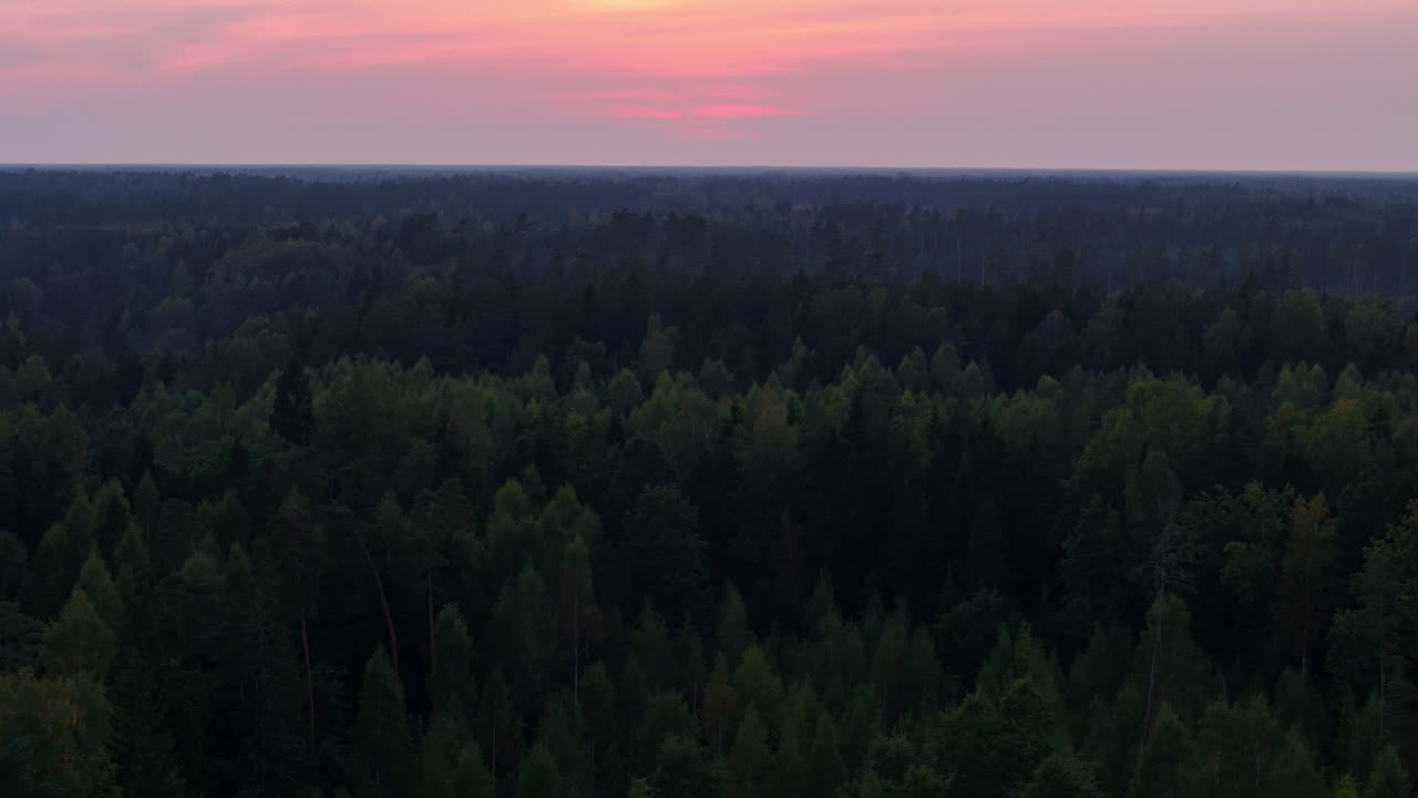Beautiful sunset in countryside of Aizpute, Latvia. Aerial pan right