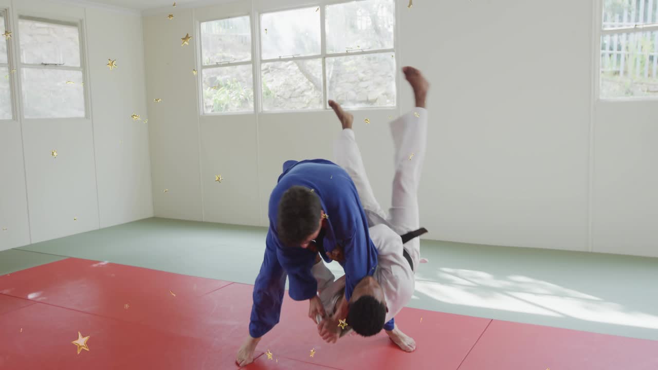 Uke stepping, gripping; tori pivoting for hipthrow on mats during dojo drills, gold stars overlay