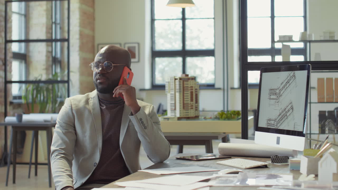 Architect on a Phone Call in a Modern Office