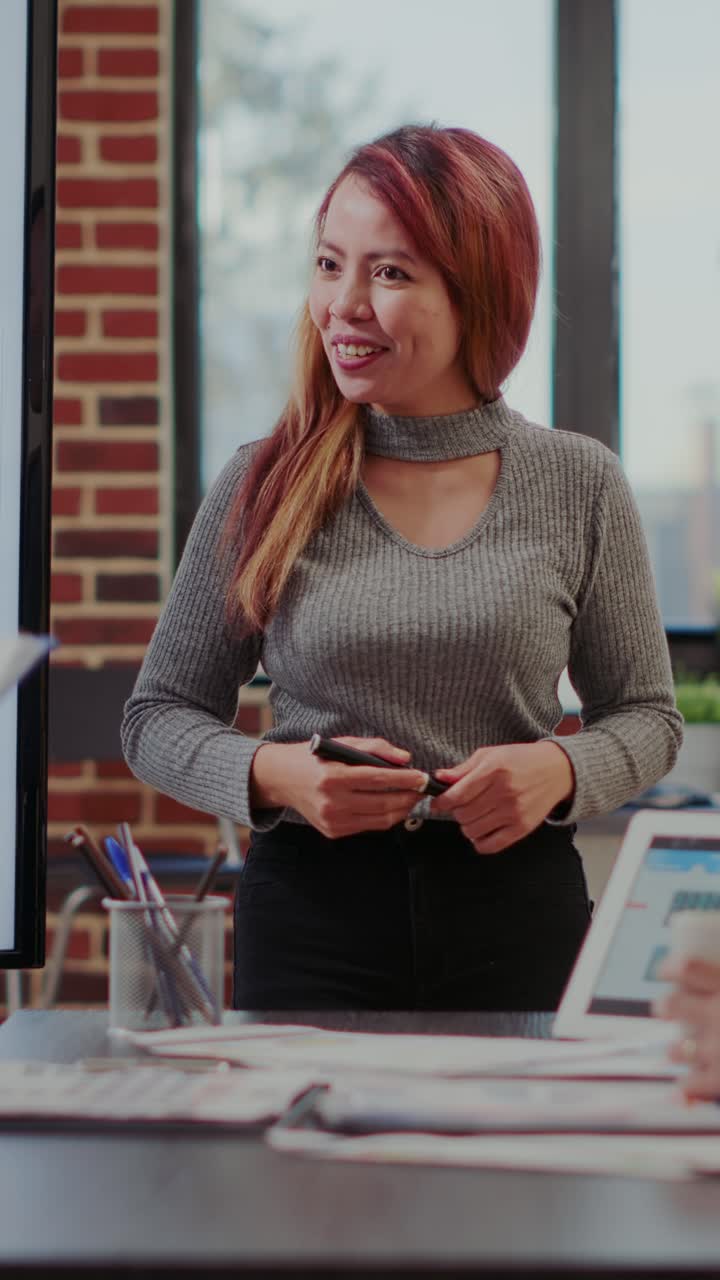 Businesswoman giving presentation in office