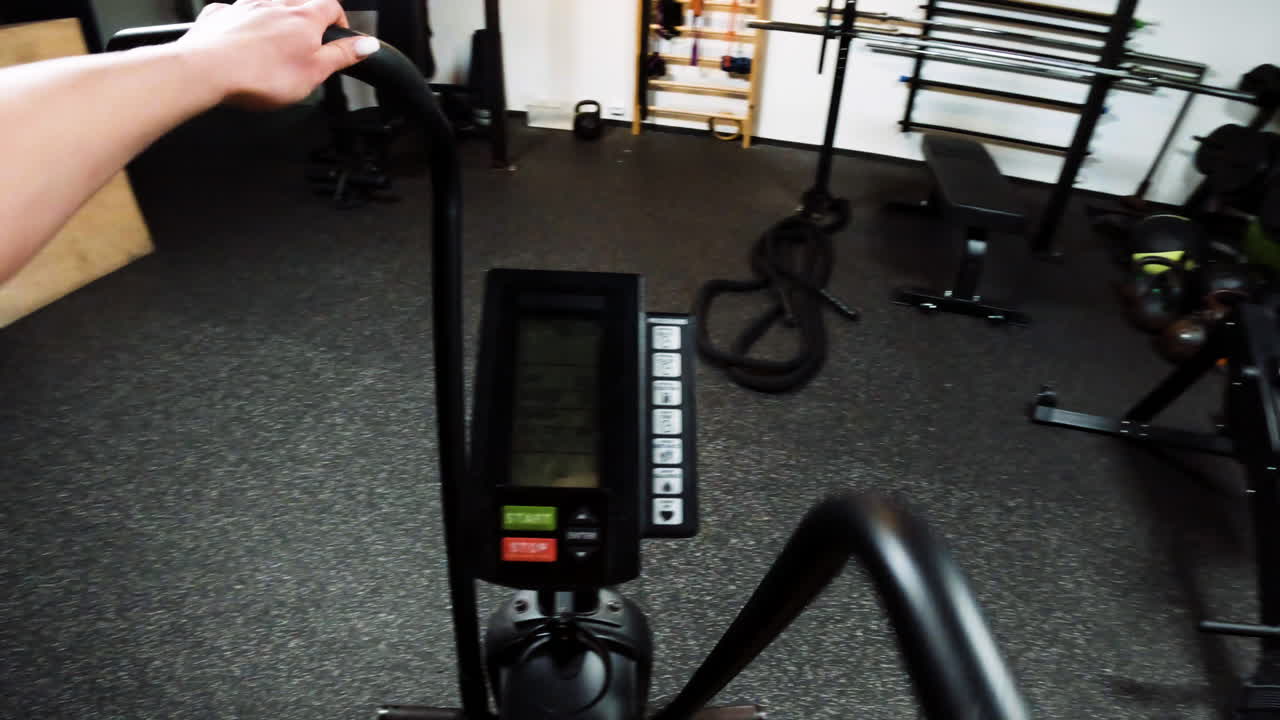 Person working out on an exercise bike in a home gym