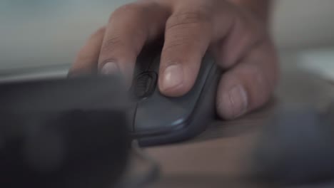 Black-male-hand-moving-and-using-a-computer-mouse