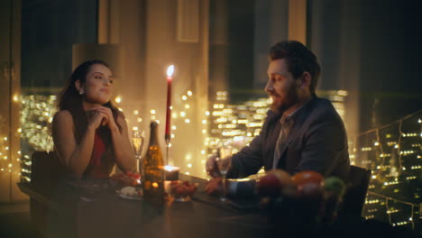 loving couple romantic evening at panoramic home closeup. lovers enjoying dinner