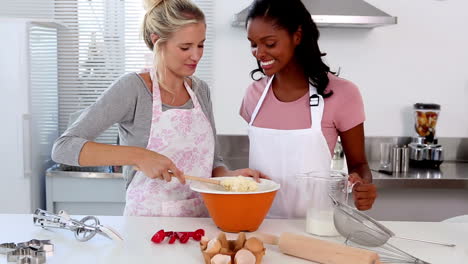 two friends home baking together