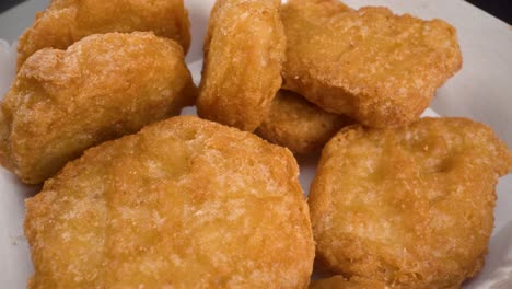 macro-view-of-chicken-nuggets-rotating-anti-clockwise-close-up-view-of-fried-fast-food