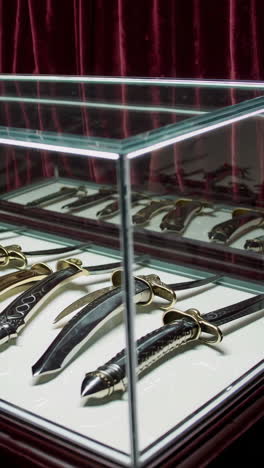 antique knives in display case