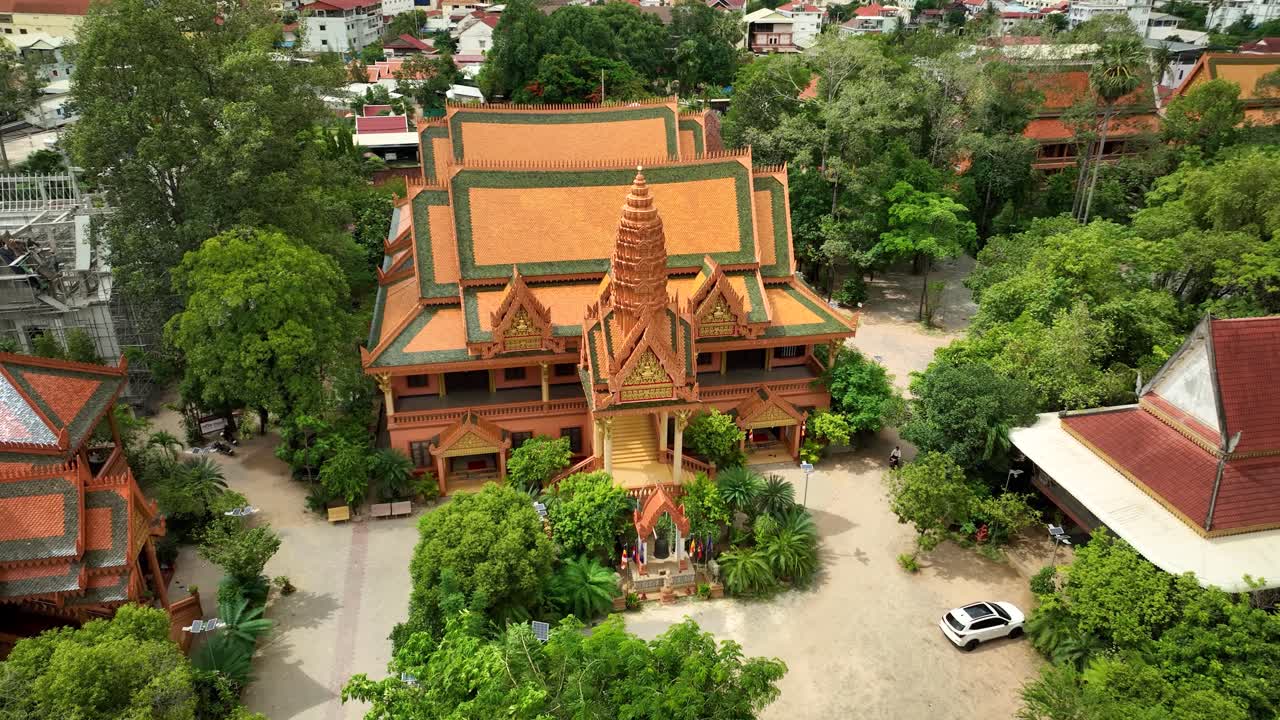 Tropical ancient landmark, ornate religious building, slow aerial orbit