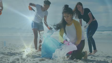 animation of lights over smiling diverse female group picking up rubbish from beach