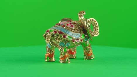 indian elephant antique jewelry ornament hand made handcraft in a turntable with green screen for background removal